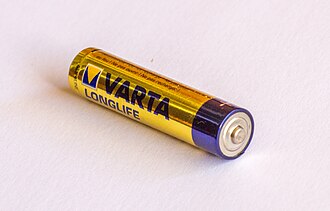 Single VARTA Longlife AA alkaline battery lying on its side on a white surface.
